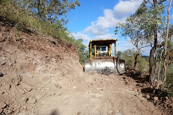 clearing rocks from land using a bulldozer
